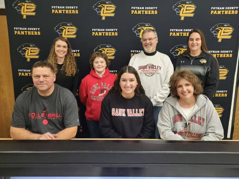 Putnam County senior Maggie Richetta (front center) signs to play volleyball for Sauk Valley College. She was joined at her signing by (front) her parents, Mike and Melissa Richetta; and (back) PC head coach Amy Bell, her bother, Stevie, Sauk Valley coach Jay Howell, and PC assistant coach Shannon Jenkins. Richetta was named as the NewsTribune's Player of the Year.