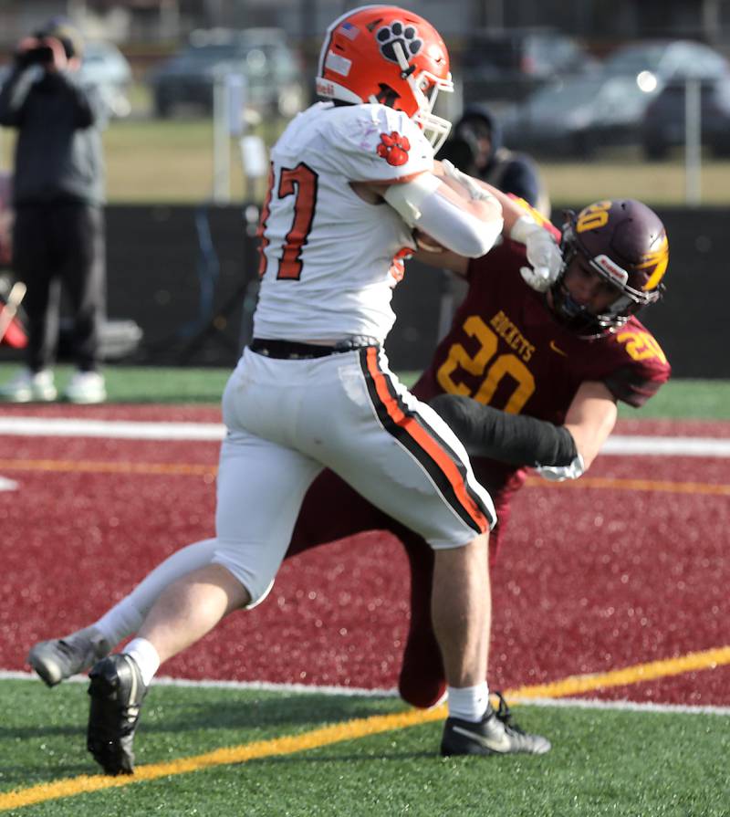 Byron’s Caden Considine runs over Richmond-Burton's Luke Johnson to score a touchdown during an IHSA Class 3A semifinal playoff football game on Saturday, November 22, 2025, at Richmond-Burton High School, in Richmond.