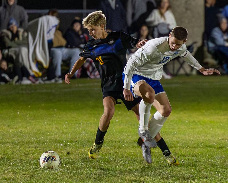 Carson Harper (21) of Somonauk/Leland/Newark pursues ball as Jacob Orin (13) of Hinckley-Big Rock is pushed away during the Little Ten Conference Championship match on Thursday, Oct. 9, 2025 at Hinckley-Big Rock School in Hinckley.