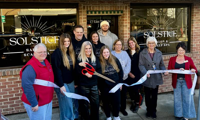Owner Shelley McCarty stands with family, friends and members of the Sauk Valley Chamber of Commerce for the grand-opening and chamber ribbon-cutting of her new business, Solstice Salon & Scalp Spa at 17 E. Third St. in Sterling, IL.