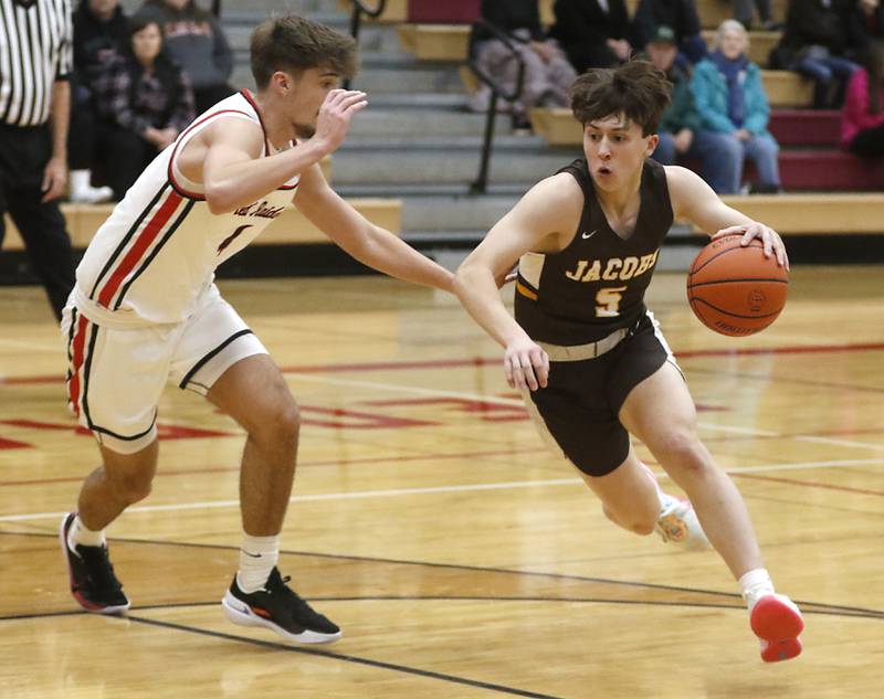 Huntley's Matt Krueger drives the lane against Huntley's Ian Ravagnie during a Fox Valley Conference boys basketball game Tuesday, Jan. 24, 2023, at Huntley High School.