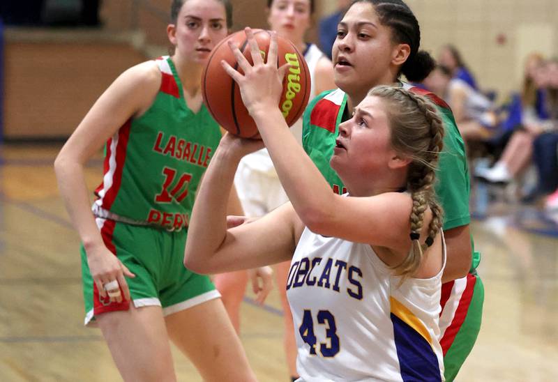 Somonauk's Kiley Mason gets off a shot in front of LaSalle-Peru's Jasmine Garman during their game Thursday, Nov. 16, 2023, in the Tim Humes Breakout girls basketball tournament at Somonauk High School.