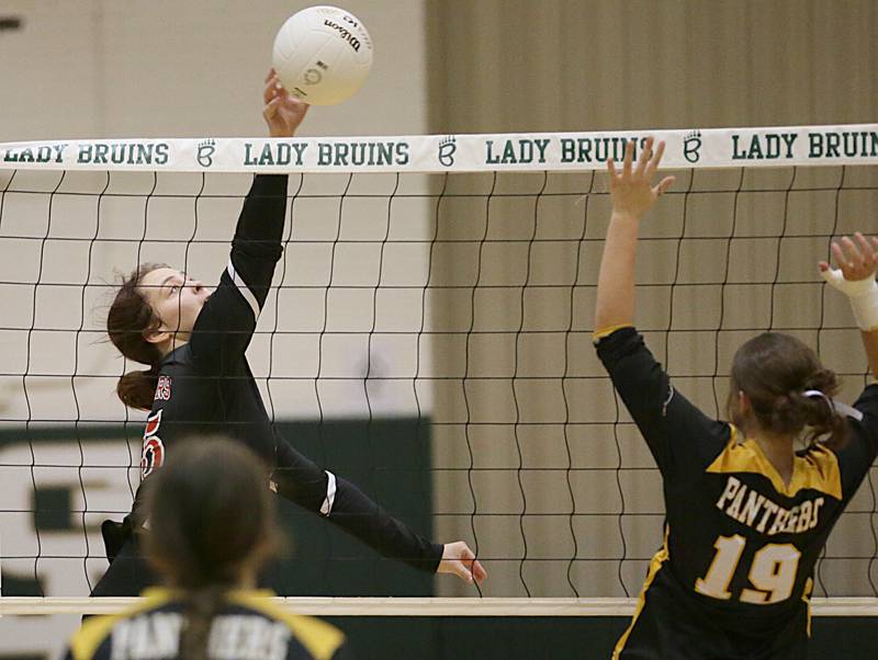 Earlville's Nevaeh Sansone (25) spikes the ball to Putnam County's Avery Moutray (19) in the Class 1A Regional game on Monday, Oct. 24, 2022 at St. Bede Academy in Peru.