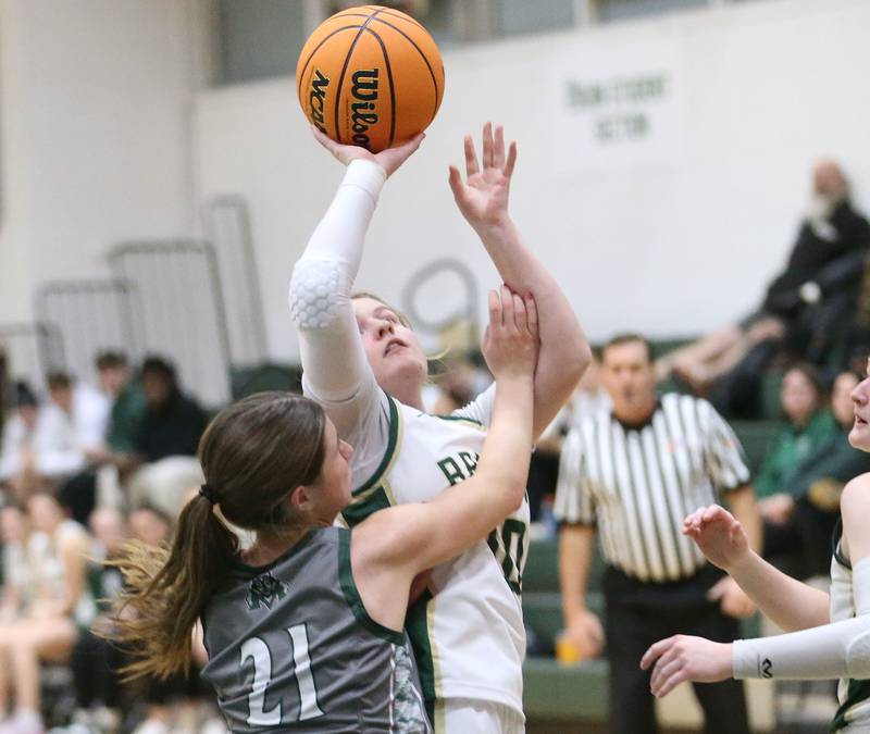 St. Bede's Ashlan Herrsink posts up for a shot over Midland's Adalynn Stickel on Thursday, Dec. 4, 2025 at St. Bede Academy.