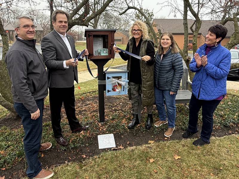 Fox Valley Hands of Hope in Geneva established two wind phones – one for adults and one for children, where grieving people can talk to their lost loved ones. FVHH Executive Director Jonathan Shively, (left), Mayor Kevin Burns, and wind phone committee members Lisa Safran, Kim North Byrne and Lynda McGrath cut the ribbon for the wind phones Thursday, Nov. 20, recognized as National Children's Grief Awareness Day.