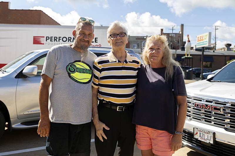 Fred Rogers (left) and Gina Bonavia worked with John Groshans in keeping the riverfront beautiful.