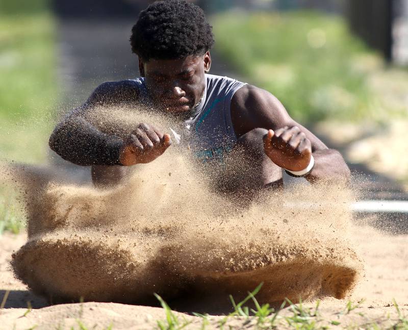 Woodstock North’s JR Fadahunsi competes in the long jump in KRC Conference Track Meet action at Richmond-Burton High School in Richmond on Tuesday, May 13, 2025.
