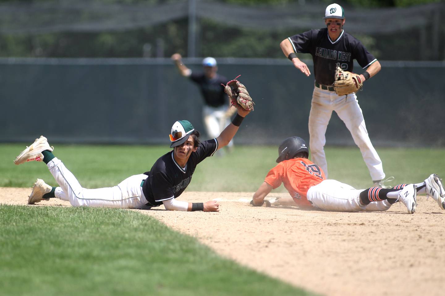 Glenbard West’s Jason Valdez gets St. Chalrs East’s Clay Jensen out at second base during the Class 4A Glenbard West Regional final in Glen Ellyn on Saturday, May 28, 2022.