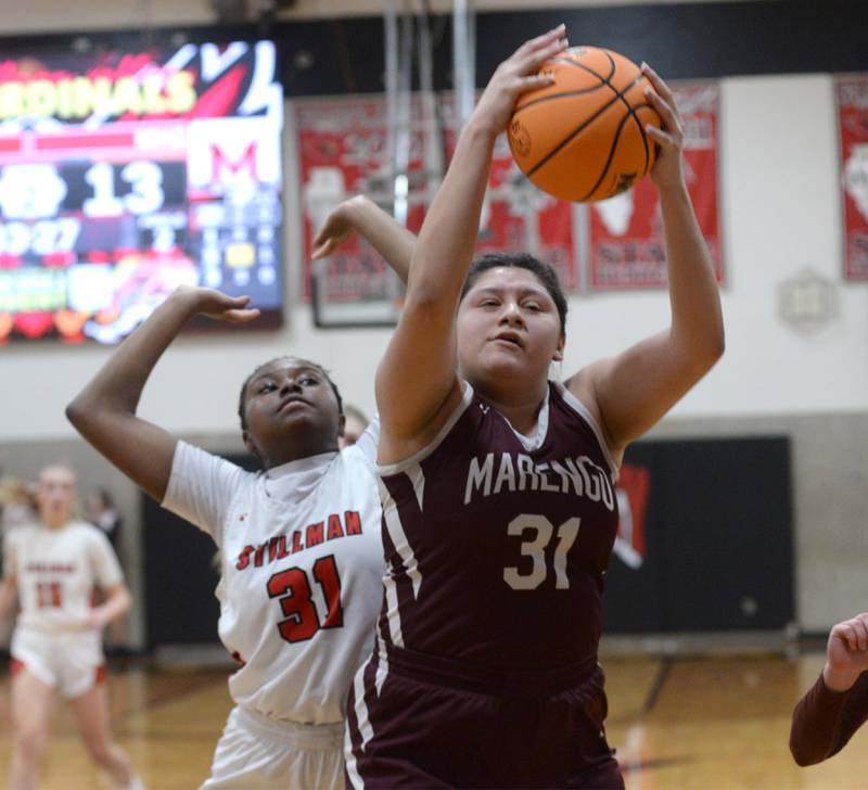 Marengo's Arianna Rodriquez (31) rebounds against Stillman Valley's Dailene Wade during the 2A Stillman Valley Sectional on Monday, Feb. 17, 2025 at Stillman Valley High School.