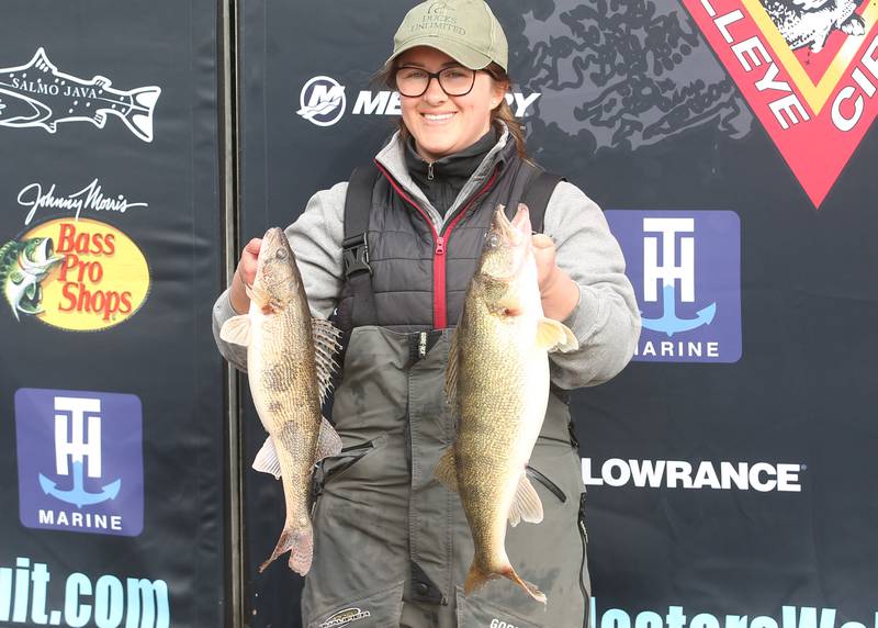Jena Herrick of Spring Valley, holds up her walleye fish that she caught during the annual Masters Walleye Circuit tournament on Friday, March 21, 2025 at the Spring Valley Boat Club.