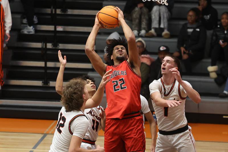 Bolingbrook’s JT Pettigrew draws the foul taking a shot against Minooka on Tuesday, Dec. 17, 2024 in Minooka.