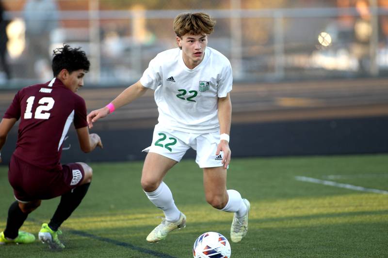 York’s Jayden Waski (22) gets control of the ball away from Elgin’s Geo Catalan (12) in the first half of the 3A Boys Soccer Supersectional at Streamwood High School on Tuesday, Nov. 1, 2022.