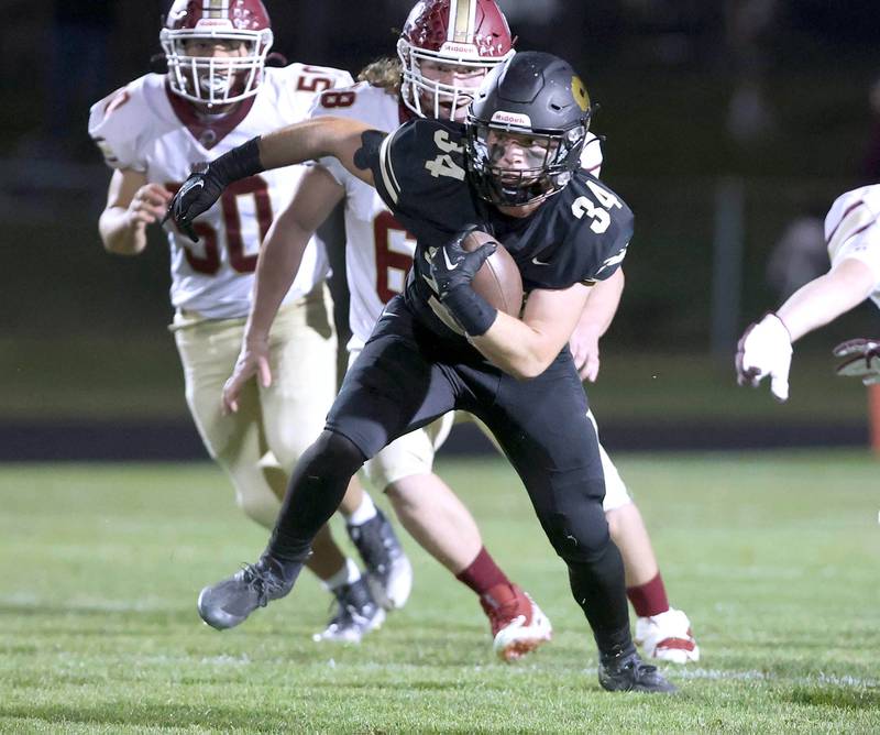 Sycamore's Joey Puleo gets through the Morris defensive line during their game Friday, Oct. 21, 2022, at Sycamore High School.