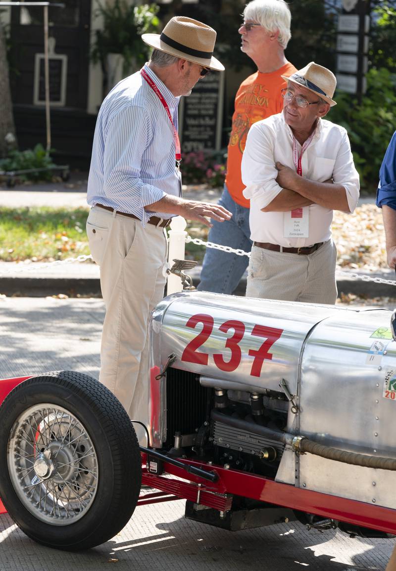 Owner David Watts, left, of Grayslake, talks to Ron Falk, about his 1923 Amilcar Monoposto during  the 2024 Geneva Concours d'Elegance on Sunday, August 25, 2024 in downtown Geneva. Car enthusiasts gathered along Third Street to display classic, antique and modern automobiles.