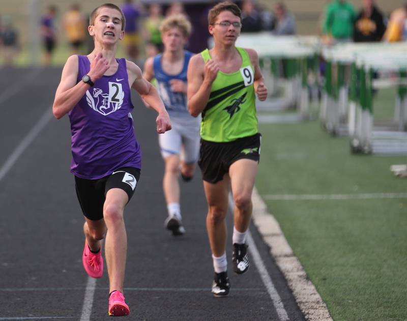 Dixon's Aaron Conderman and Rock Fall's Darien Huggins compete in the 3200 meter run during the Class 2A track sectional meet on Wednesday, May 17, 2023 at Geneseo High School.