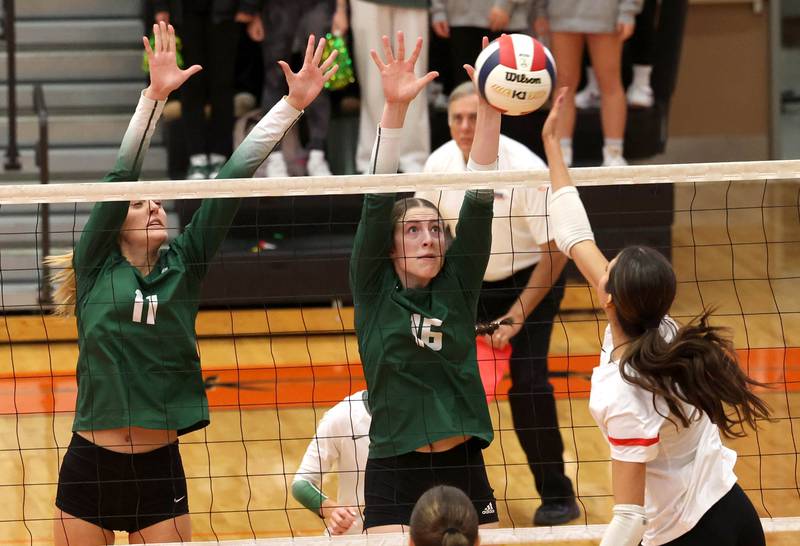 Fremd’s Natasa Radisic (left) and Sasha Sallade try to block Huntley's Diellza Sejdini Monday, Nov. 11, 2024, during their Class 4A supersectional match at DeKalb High School.