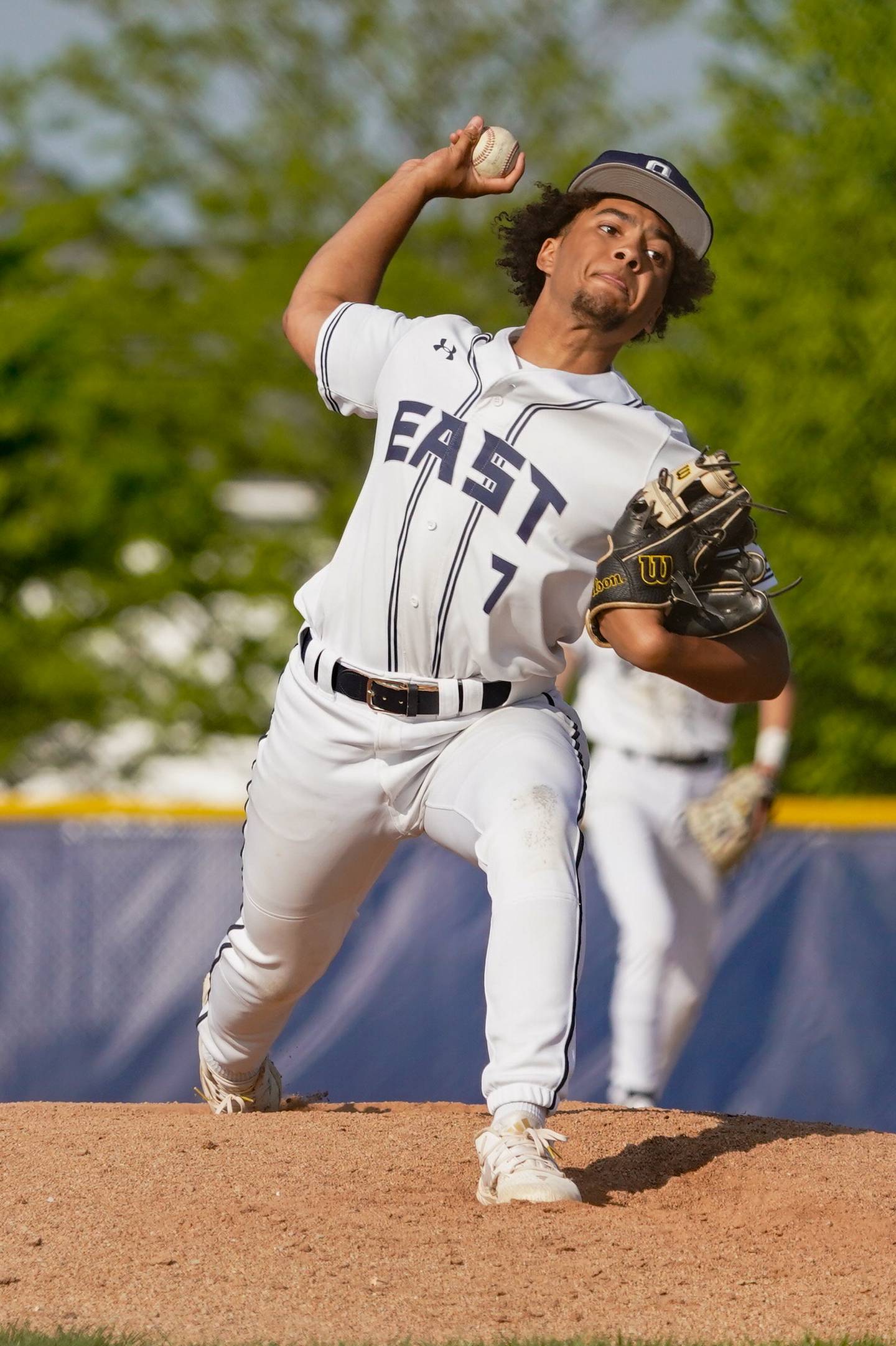 Oswego East's Ernest Williams (7) delivers a pitch against Yorkville during a baseball game at Oswego East  High School on Monday, May 6, 2024.