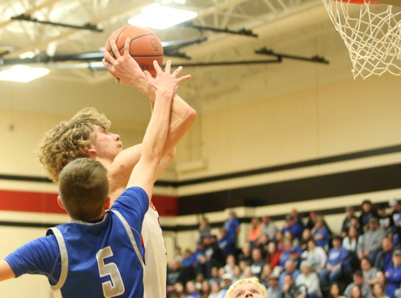 Morrison's Brenden Martin eyes the hoop as Princeton's Landen Koning defends during the Class 2A Regional final game on Friday, Feb. 23, 2024 at Erie-Prophetstown High School.