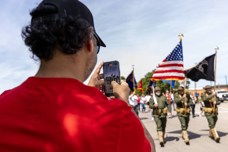 Bhanu Singh of Plainfield uses his cellphone to capture the Plainfield American Legion Marne Post 13 Memorial Day Parade on May, 26, 2025.