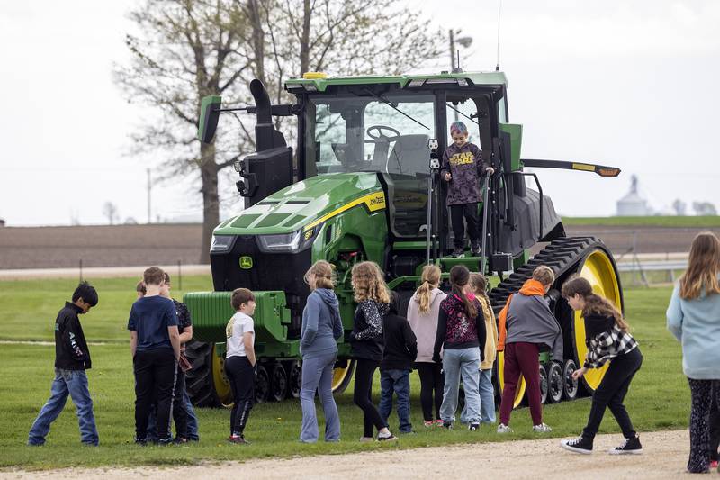 Fifth graders check out a tractor Friday, April 25, 2025, during Ag Expo at the Lee County 4H Fairgrounds.