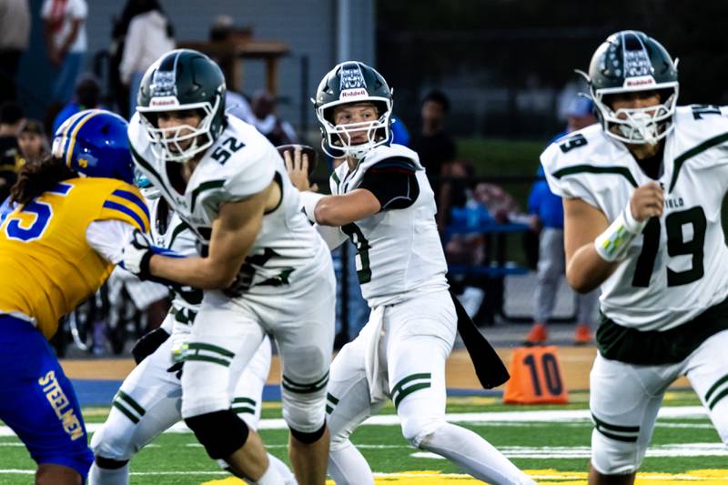 Plainfield Central's Tommy Morrisette looks for an open teammate during a varsity football away game against Joliet Central on Sept. 26, 2025.