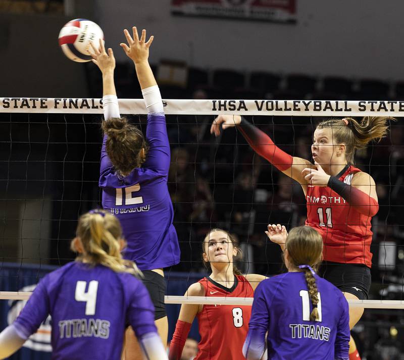 Timothy Christians' Ella Rickert spikes against El Paso-Gridley's Eliza Meiss Saturday, Nov. 16, 2024, in the Class 2A third place state volleyball match at CEFCU Arena in Normal.
