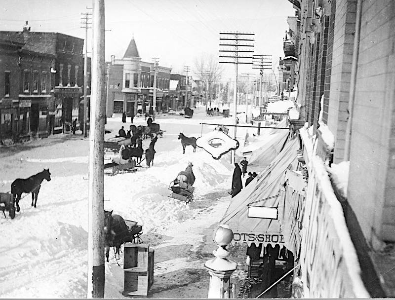 The “Big Snow of 1898” is seen looking west between Second and Third streets along Lincoln Highway in DeKalb.