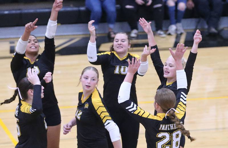 Members of the Putnam County volleyball team react after scoring a point against Serena on Monday, Sept. 22, 2025 at Putnam County High School.