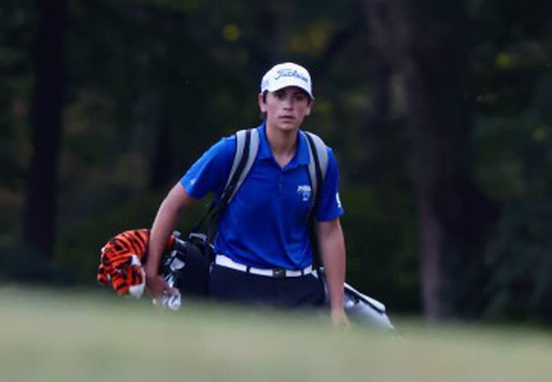 Princeton's Cayden Benavidez walks the course at Chapel Hill Golf Course on Thursday.