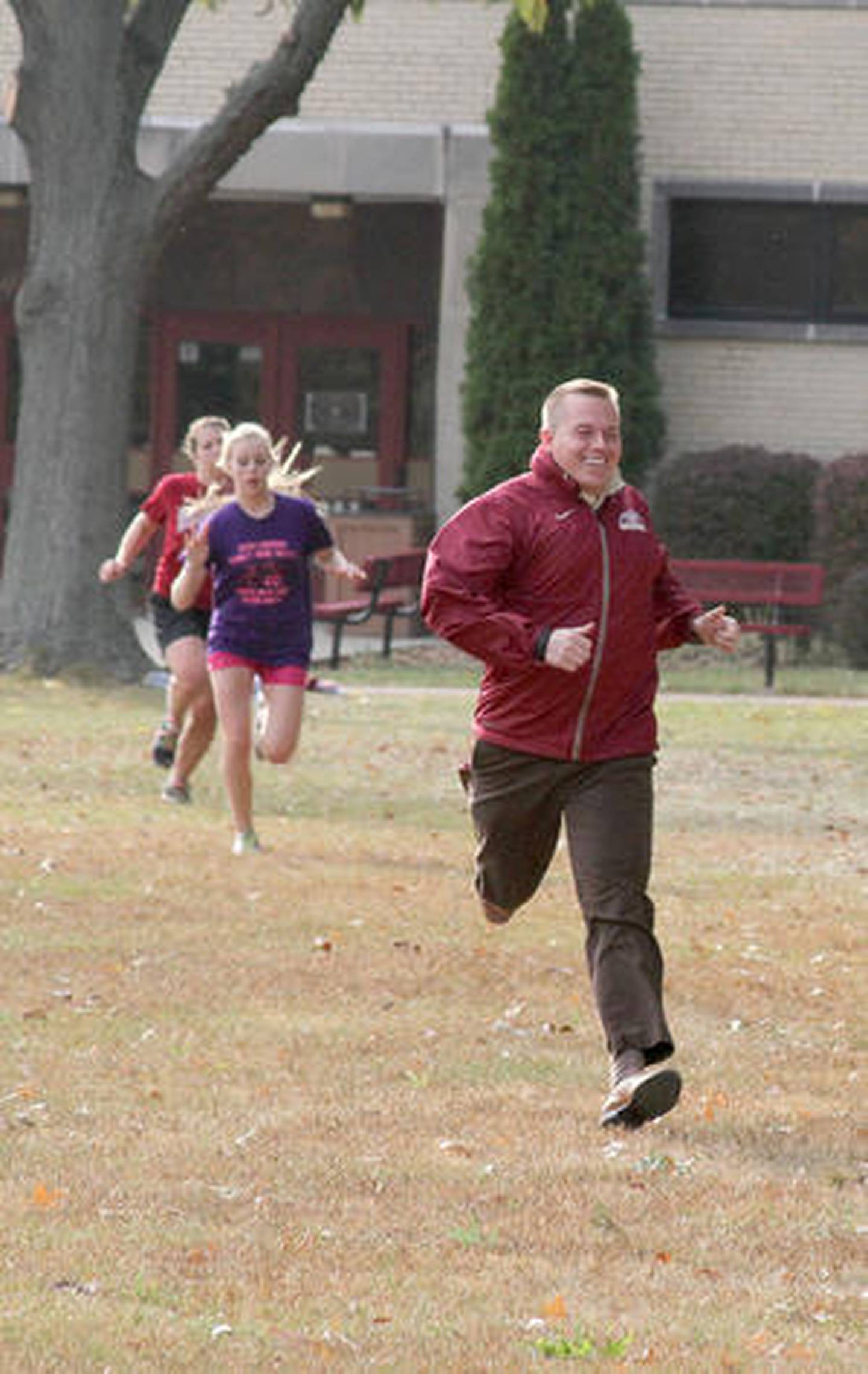 Morris cross country coach Joe Blumberg runs with his team at a practice this past week.