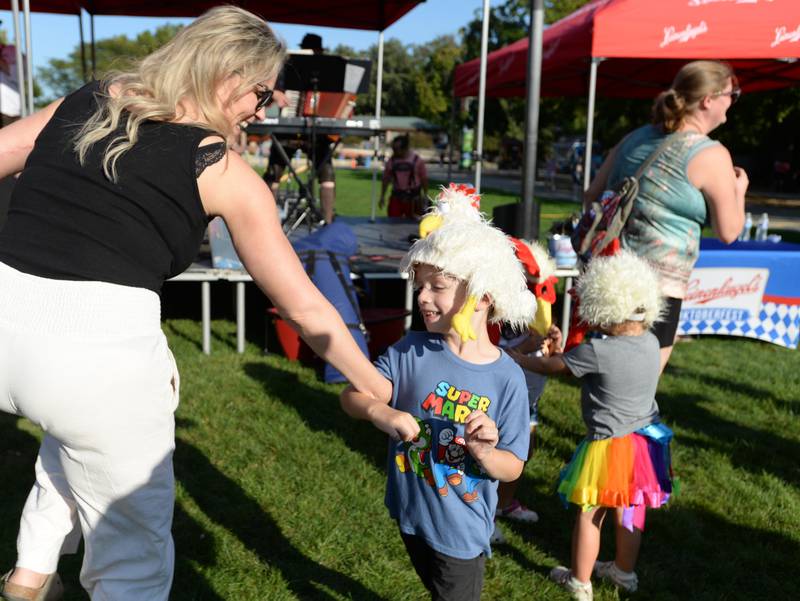 Renee and Dean Matthes of Westmont do the chicken dance while attending the Octoberfest held at Brookfield Zoo Saturday, Sept. 23, 2023.