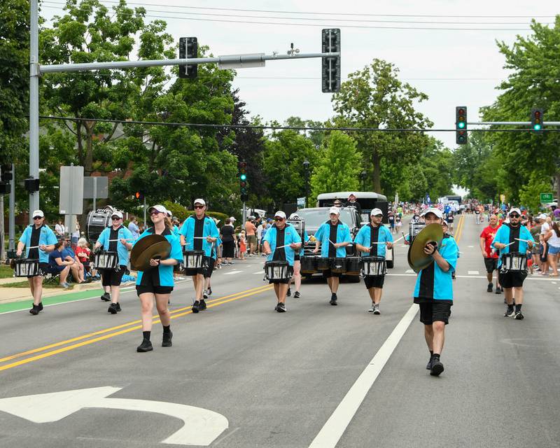 Crystal Lake Strikers drum their way down the parade route on Friday July 4, 2025, during the Independence Day parade in downtown Downers Grove.