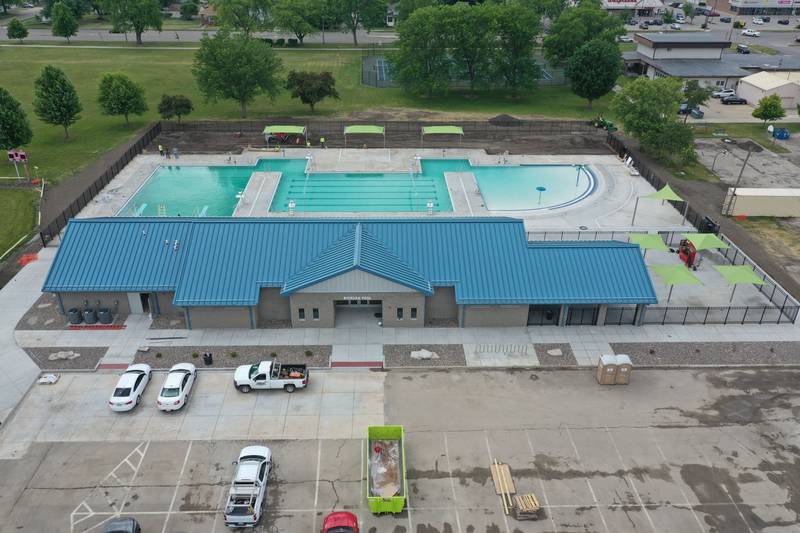 Workers fill Riordan Pool on Tuesday, June 13, 2023 in Ottawa. The pool will open June 19 to the public. The construction of the 6.7 million dollar pool began in September of 2022. The facility includes a 9,700 square foot pool, complete with a zero foot entry, six 70-foot competition lanes and three diving stands, plus a 5,700 square foot building containing private family changing rooms, locker rooms, showers, restrooms and offices.
There will be a shelter with picnic tables, vending machines and tables for umbrellas.