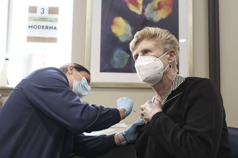 Chris DuBois receives her final dose of the Moderna COVID-19 vaccine on Wednesday, Feb. 10, 2021, at Will County Health Department in Joliet, Ill. The Will County Health Department is accelerating vaccination efforts throughout the region.