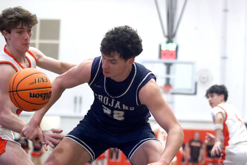 McHenry’s Garet Lobbins, left, battles Cary-Grove’s  Adam Bauer for the ball in varsity boys basketball on Tuesday, Feb. 17, 2026, at McHenry High School in McHenry.