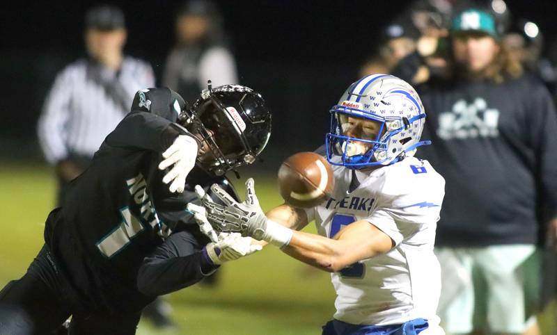 Woodstock North’s JR Fadahunsi, left, breaks up a pass intended for Woodstock’s Matthew Cress in varsity football at Woodstock North High School on Friday, October 24, 2025.