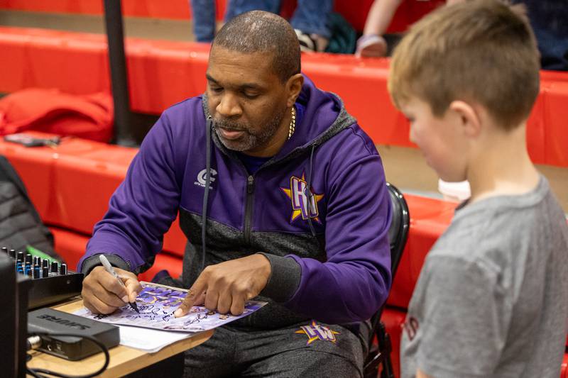 Jamal “The Voice” Thompson of the Harlem Wizards signs autograph on Wednesday, April 16, 2025 at Woodland High School in Streator.
