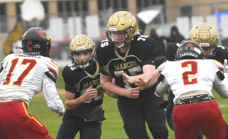 Polo lineman Wyatt Plachno (75) blocks for Mercer Mumford (83) against St. Anne during I8FA playoff action on Saturday, Nov. 8, 2025 at Polo High School.