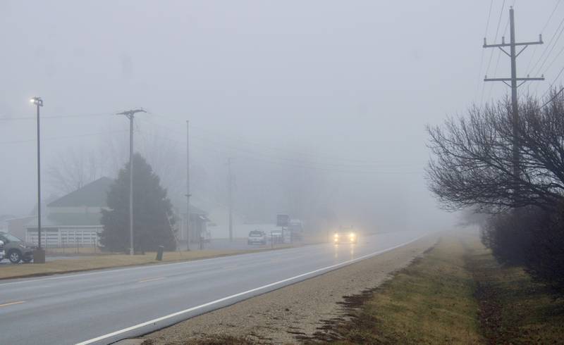 Morning fog lays heavy over Route 52 on the north side of Sublette in Lee County on Friday.