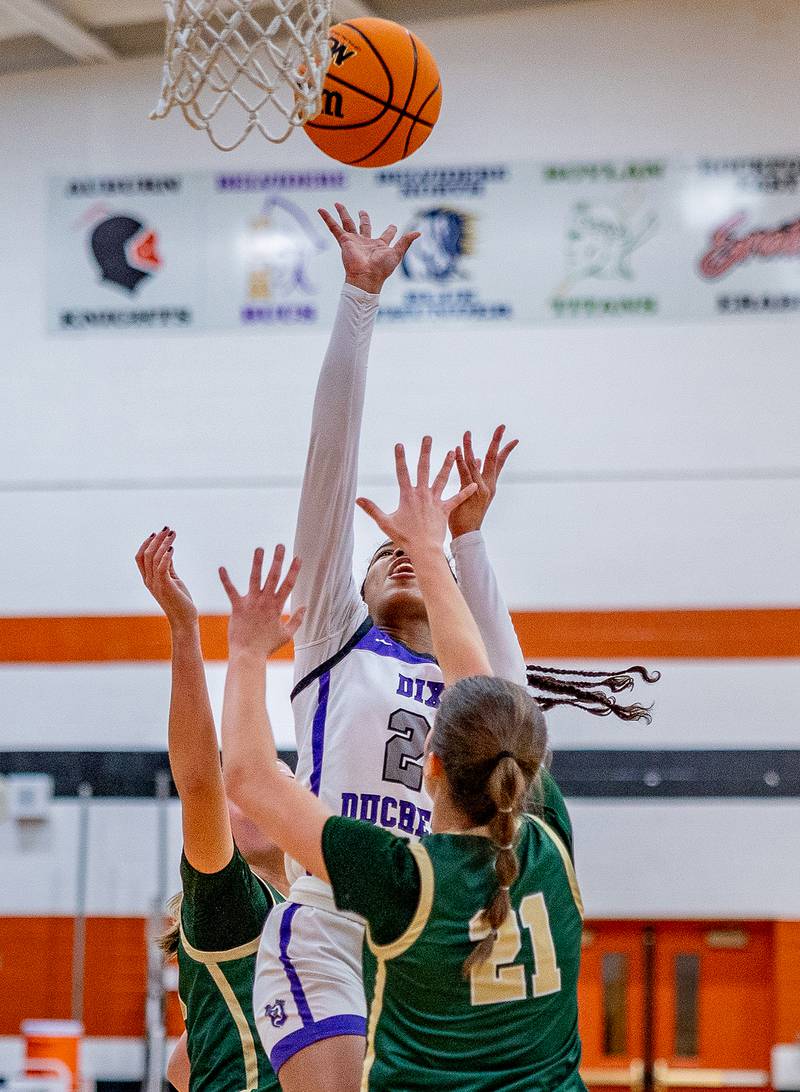 Dixon's Ahmyrie McGowan drives into the lane against Boylan defenders during the Freeport regional championship game on Thursday, February 20, 2025.