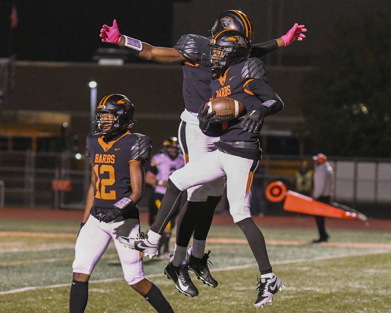 DeKalb's Billy Miller, right, celebrates with teammate DeKalb's Davon Grant, after Billy score a touchdown during the game against Andrew High School on Friday Oct. 4, 2024, held at DeKalb High School.