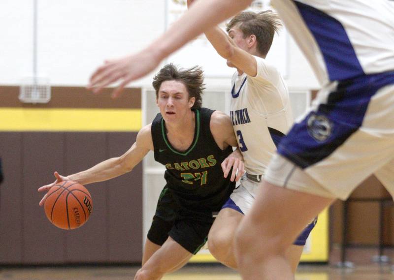 Crystal Lake South’s James Carlson drives against Lake Zurich in Hinkle Holiday Classic boys basketball tournament game action at Jacobs High School Wednesday.