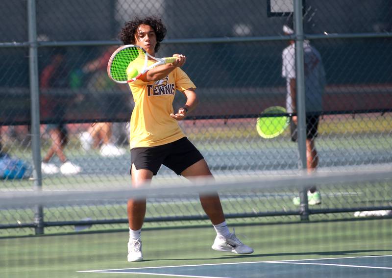 Jacobs’ Soham Kalbra returns the ball during a doubles match with partner Augie Nelson (not pictured) in the state championship preliminaries at Buffalo Grove High School on Thursday, May 23, 2024.