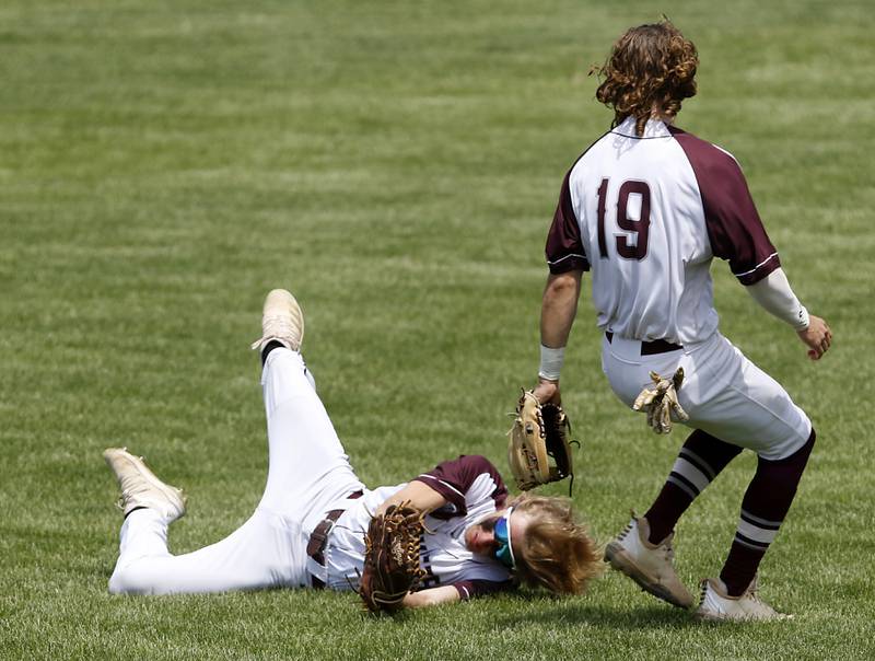 Richmond-Burton’s Ethan Schoeps makes a bases loaded inning ending catch as he avoids colliding with teammate, Joseph Mrowiec, during a IHSA Class 2A supersectional baseball game between Richmond-Burton and Timothy Christian at the Rockford Rivets Stadium in Rockford.
