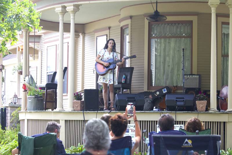 Lucy Isabel, a folk/Americana singer-songwriter, erforms in the 600 block of Western Avenue in Joliet as part of the Porch and Park Music Fest on Saturday, Aug. 16, 2025.