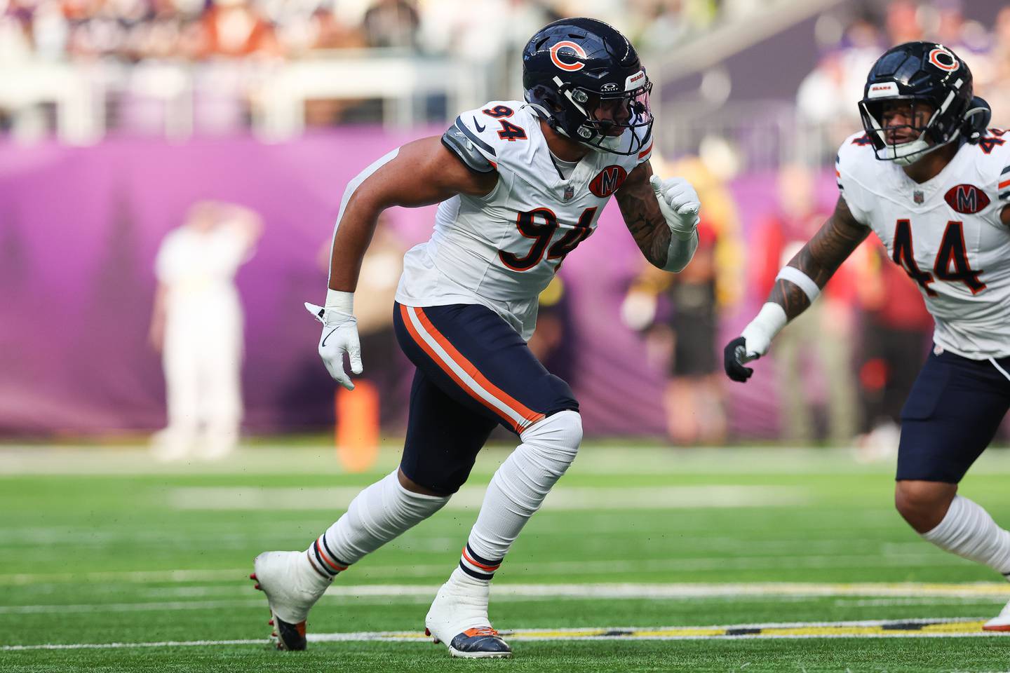 Chicago Bears defensive end Austin Booker (94) moves across the field against the Minnesota Vikings during the first half of an NFL football game Sunday, Nov. 16, 2025 in Minneapolis. (AP Photo/Stacy Bengs)