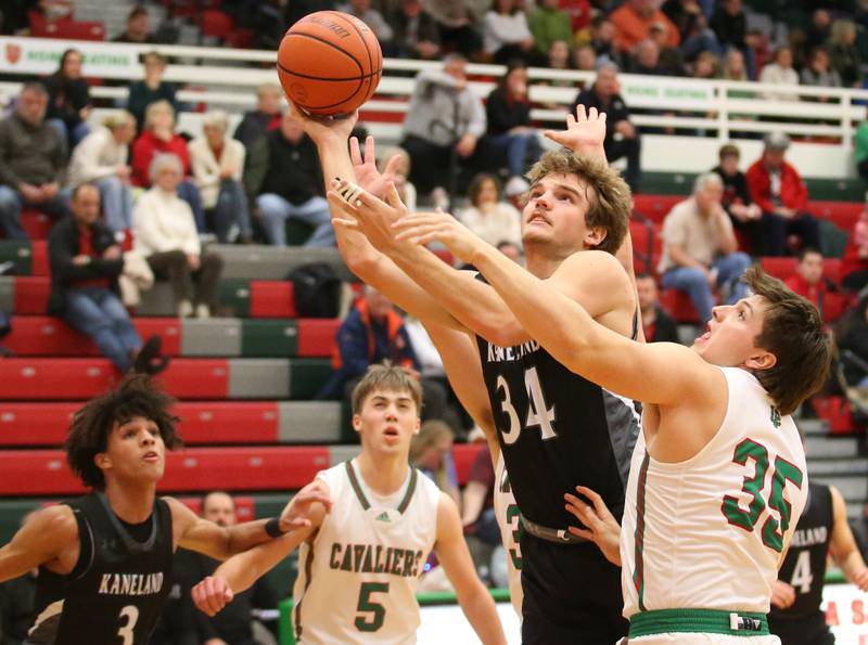 Kaneland's Parker Violett eyes the hoop while running into the lane past L-P's Nolan Van Duzer on Tuesday, Dec. 12, 2023 in Sellett Gymnasium.