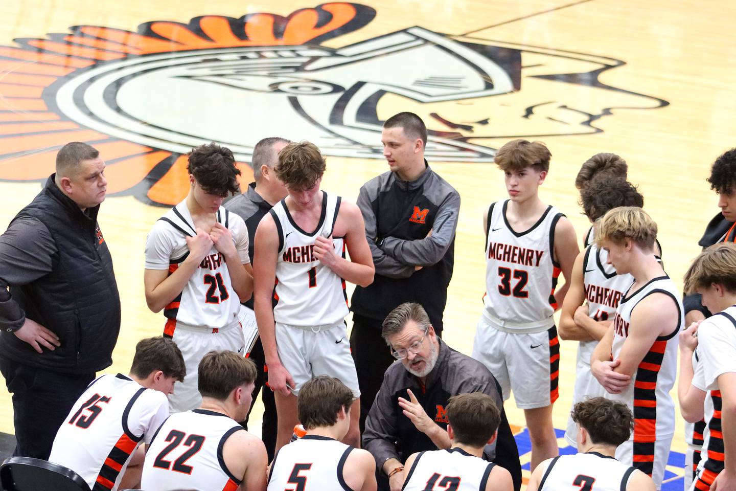 McHenry’s Head Coach Corky Card guides the Warriors to a win against  Huntley in varsity boys basketball on Wednesday, Jan. 15, 2025, at McHenry High School in McHenry.