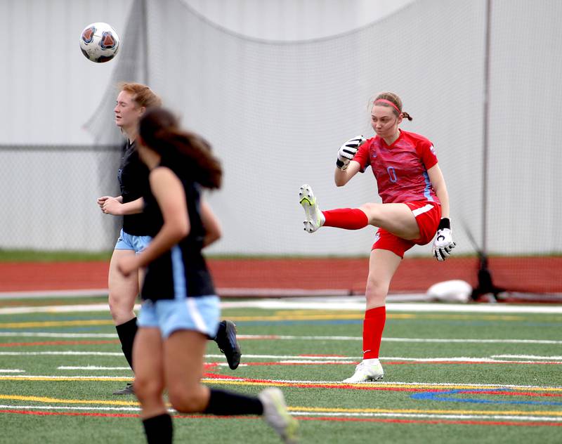 St. Charles North goalkeeper Kara Claussner kicks the ball during a Naperville Invitational game against Oswego East at Naperville Central on Saturday, April 23, 2022.