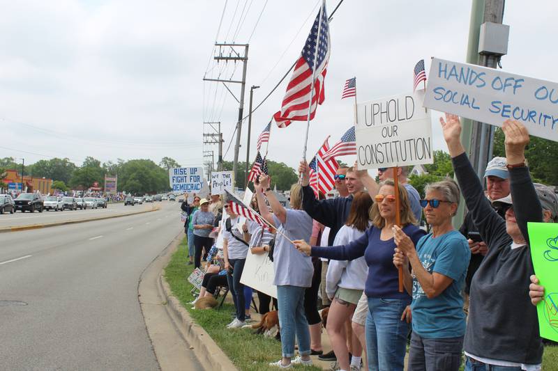 Thousands of protesters line up along Route 31 on June 14, 2025 during a "No Kings" protest in McHenry.